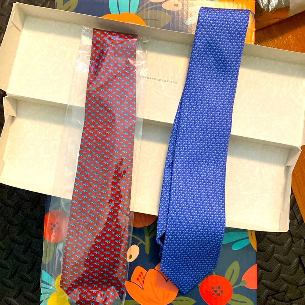 NWT. 2 ties. One red with Rhino on it and the other blue MICHAEL KORS. NEW.